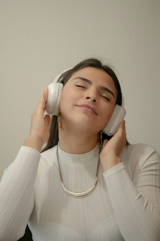 Person wearing headphones listening closely to music, representing the kind of focused listening Slicethepie reviewers do