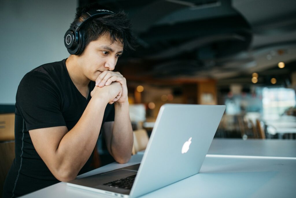 Student using apps on a laptop while studying